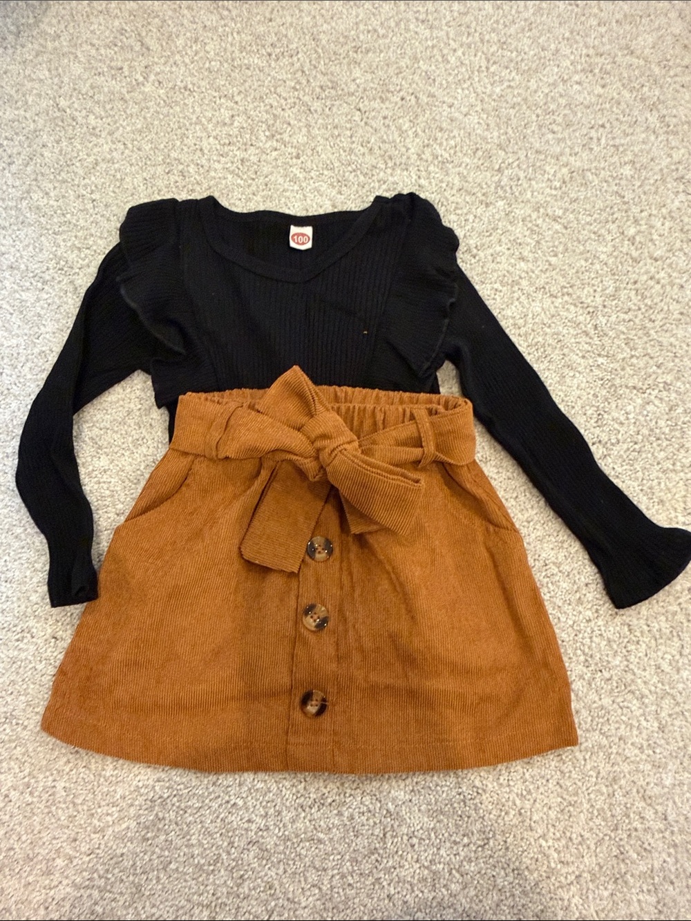 Black Ruffle Long Sleeve Top with Rust Button-Front Skirt